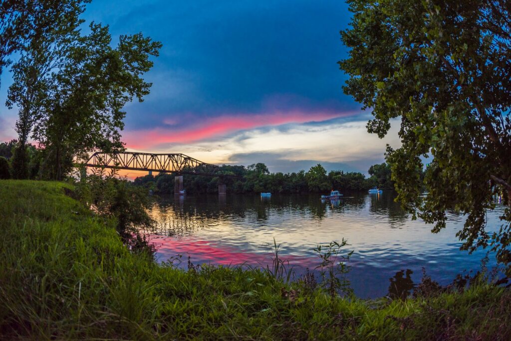 sunset over Black Warrior River with Railroad Bridge