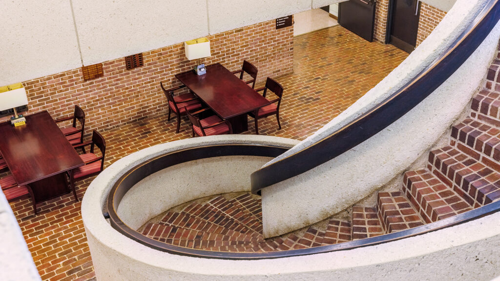 Looking down a brick spiral staircase