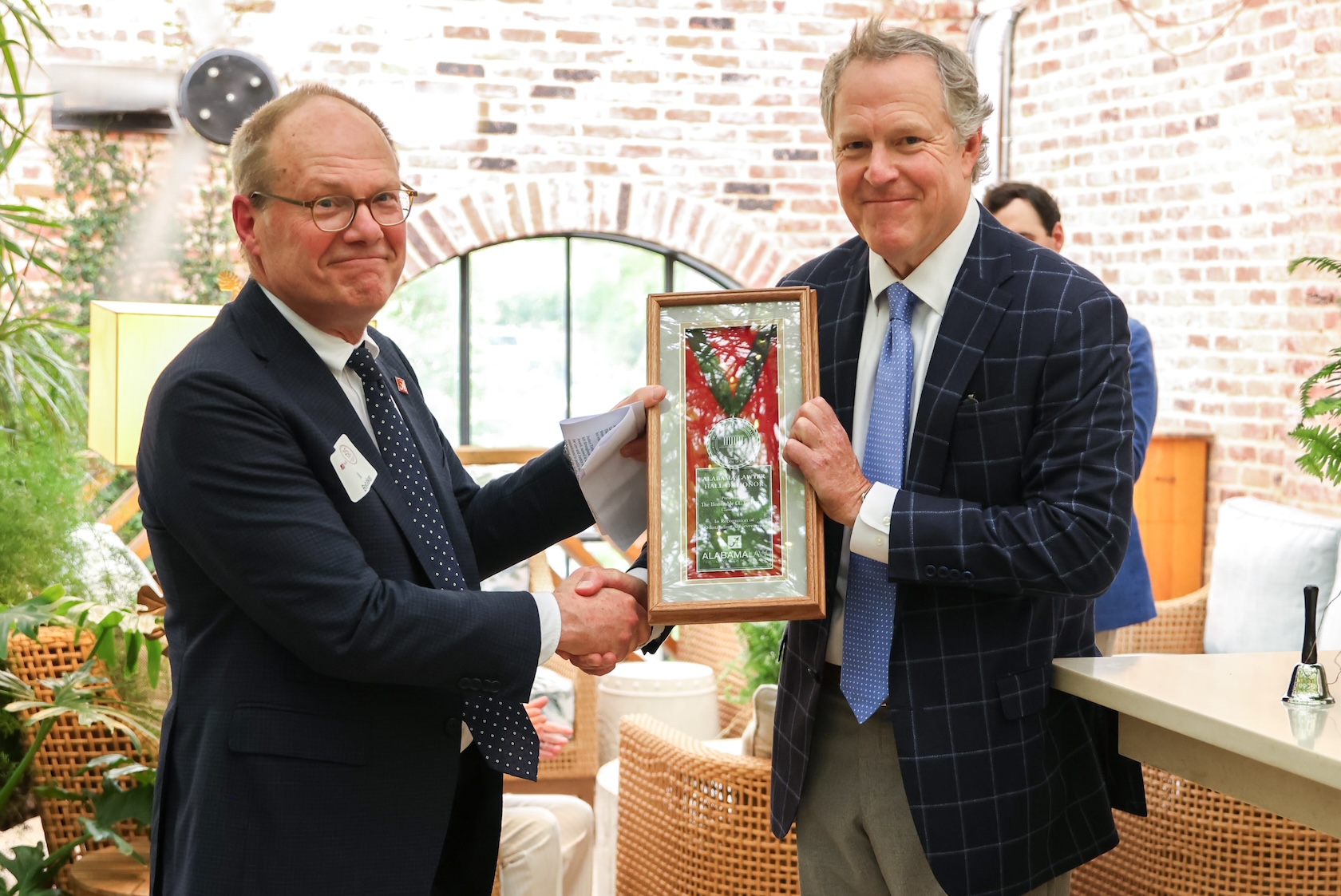 Justice C.C. Torbert's son, Clay Torbert Jr. (‘92) accepted the award on behalf of his father. Pictured with Dean Bill Brewbaker.