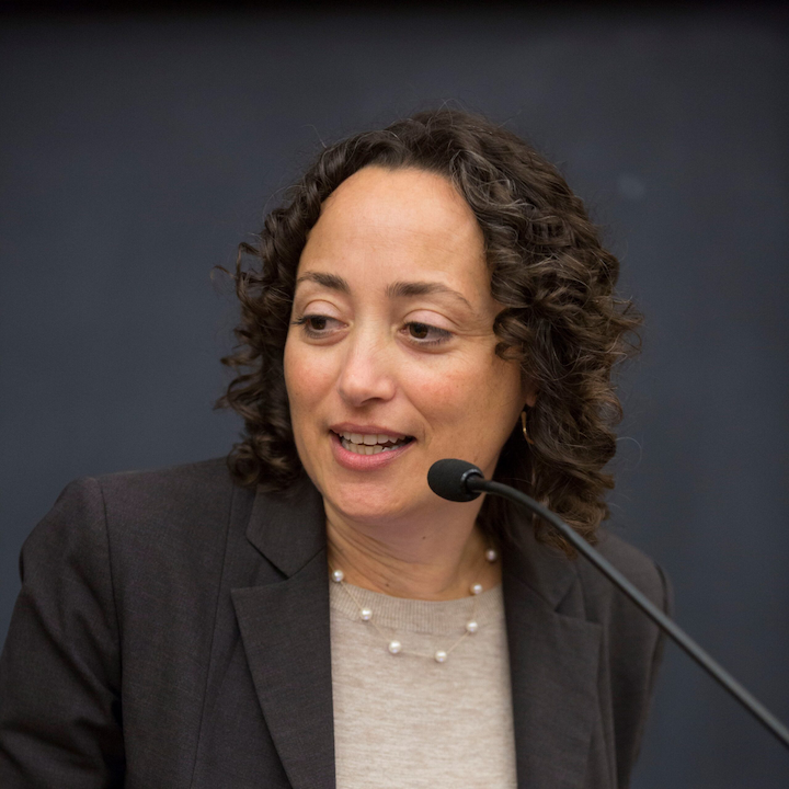 Catherine Lhamon speaking into a microphone