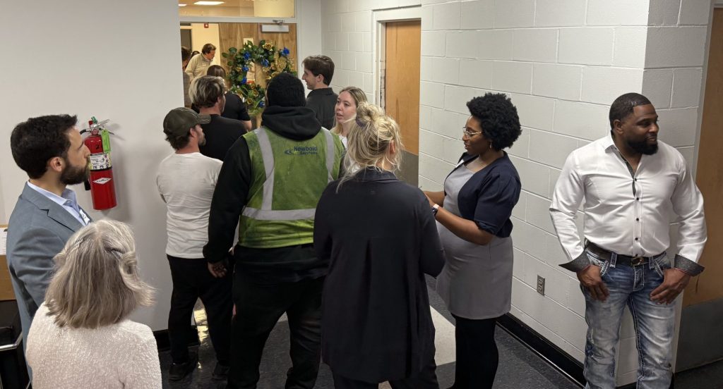 Clinic students assist community members seeking driver's license restoration.