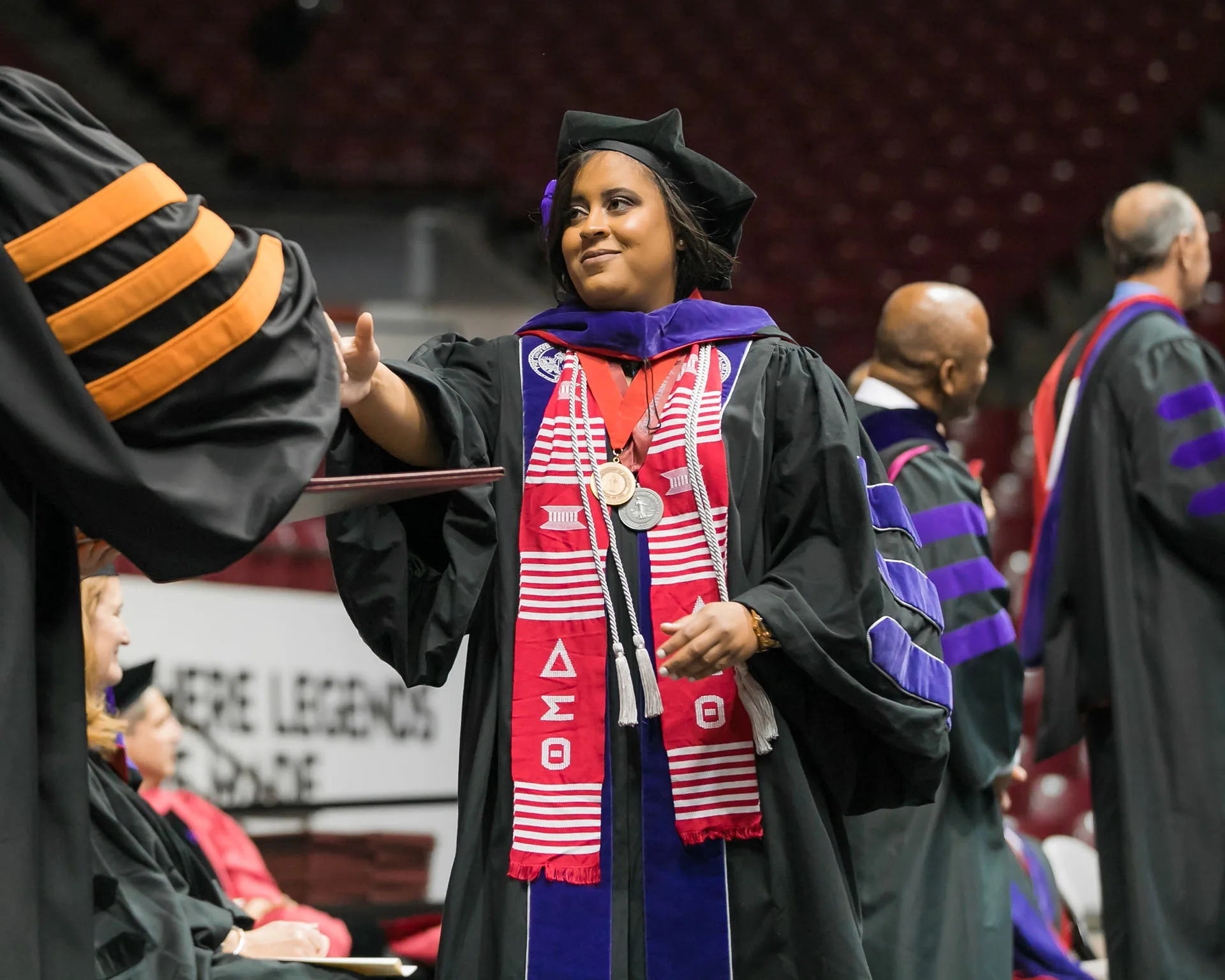 Graduate shaking hands with the dean