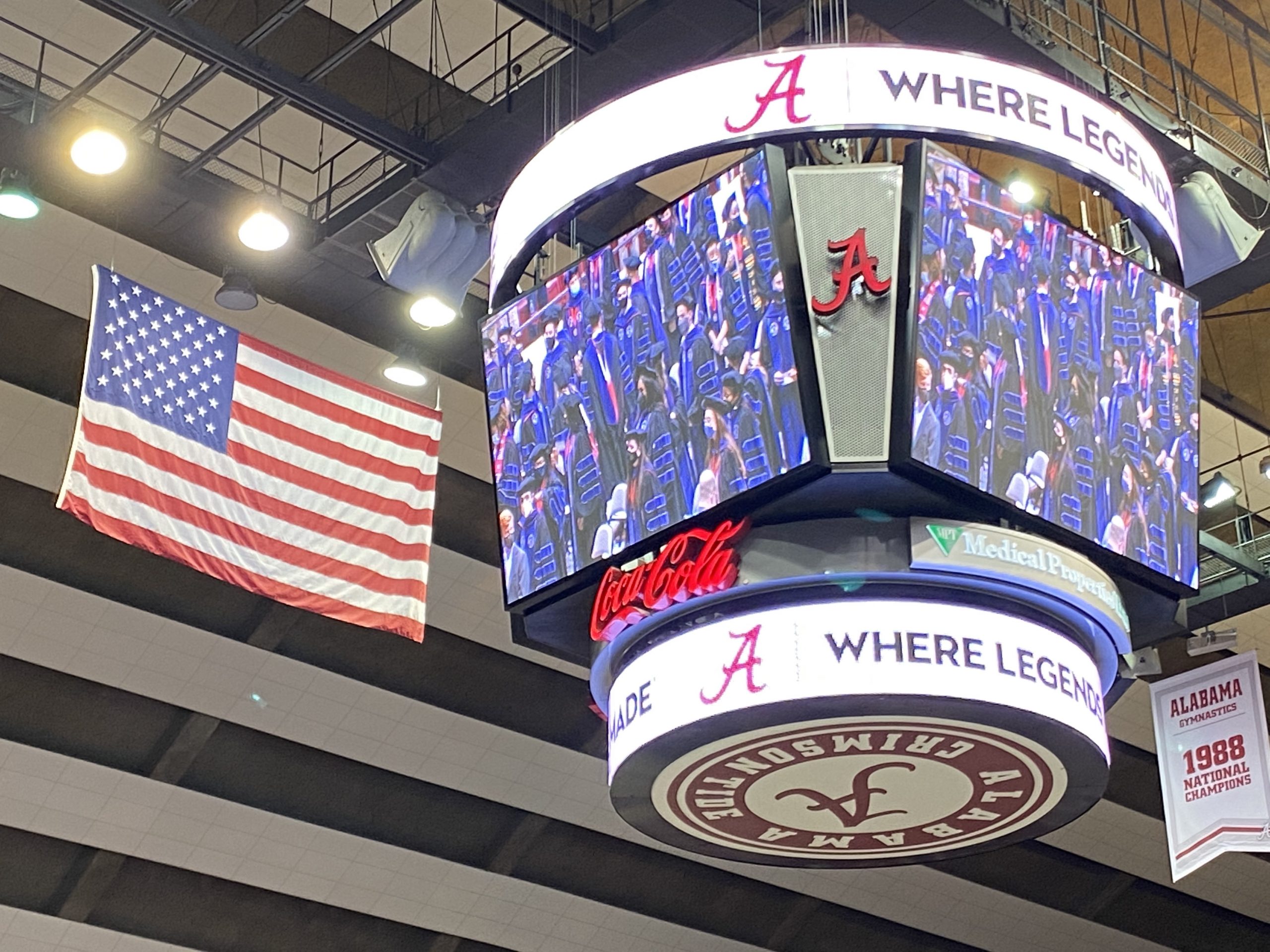 2021 & 2020 Alabama Law Graduates appear on the Jumbotron at Coleman Coliseum.