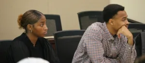 Two students listening to a lecture