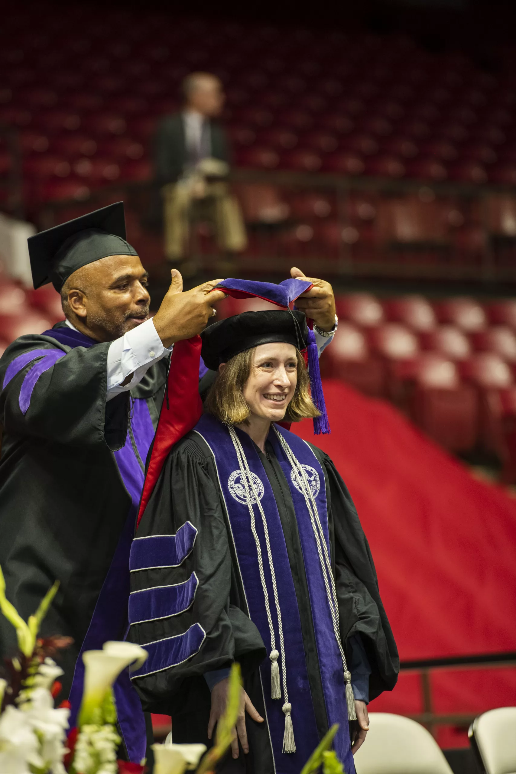 Student hooded by professor Bryan Fair at Alabama Law 2023 Commencement Ceremony