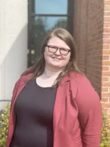 Meghan McLeroy poses in front of The University of Alabama School of Law