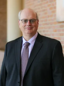 Professor Ronald Krotoszynski poses at The University of Alabama School of Law entrance.