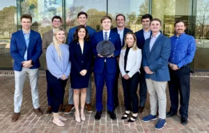 2024 Federalist Society Board poses in front of the law school